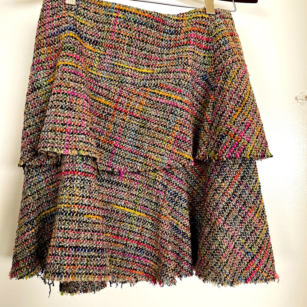 Multi color tweed Trina Turk suit with pink satin lining & tiered skirt.